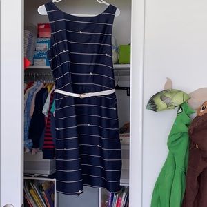 A navy blue dress with gold nautical detail.
